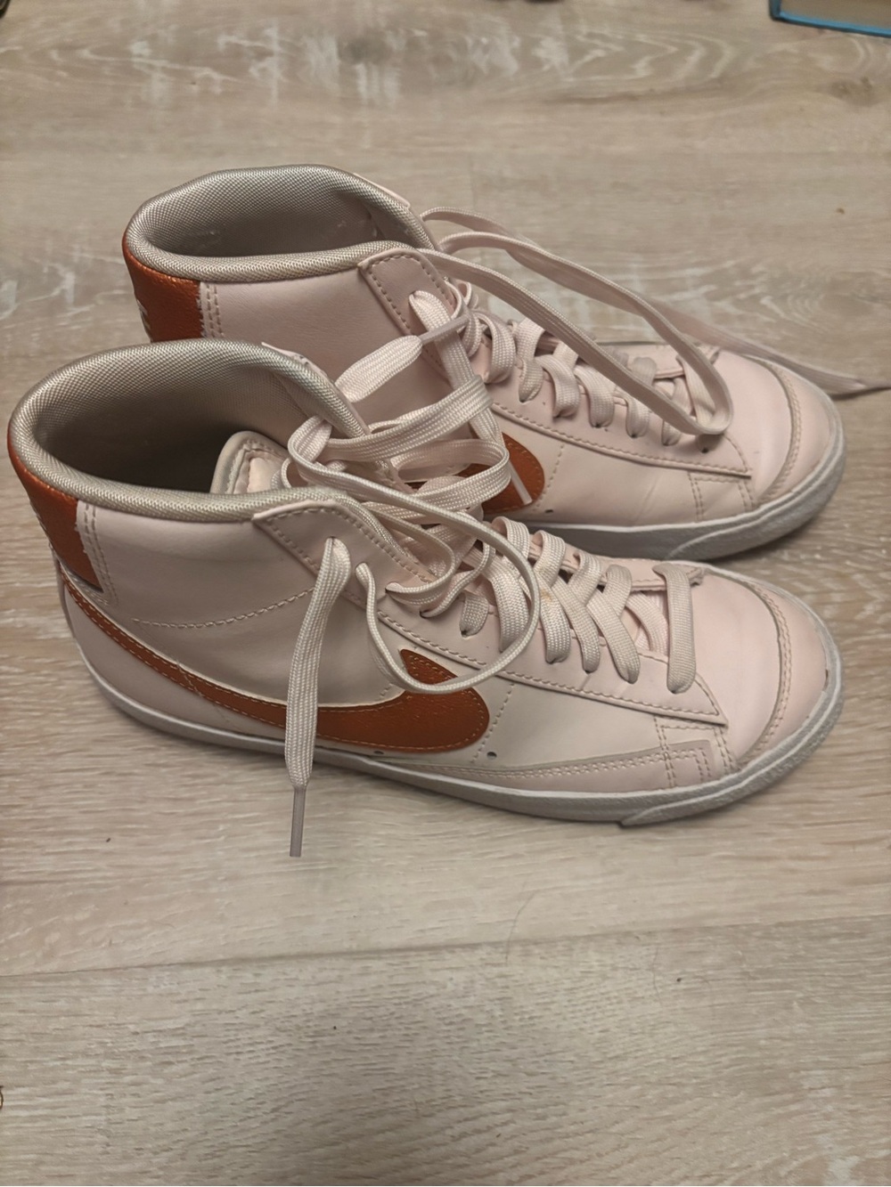 Nike Women’s Pale Pink High-Top Sneakers with Orange Swoosh